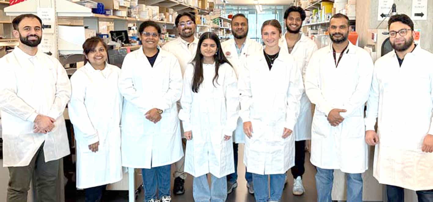 محققین کی ٹیم لیبارٹری میں تجربات کرتے ہوئے، سائنسدان اور محققین جدید تحقیق میں مصروف.