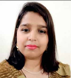 خاتون کی تصویر، سیاہ بال اور ہلکی مسکراہٹ کے ساتھ.