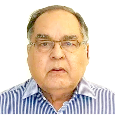 معروف سیاستدان کی تصویر، سرکاری لباس میں، عینک کے ساتھ.